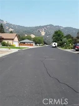 a view of a street with a mountain