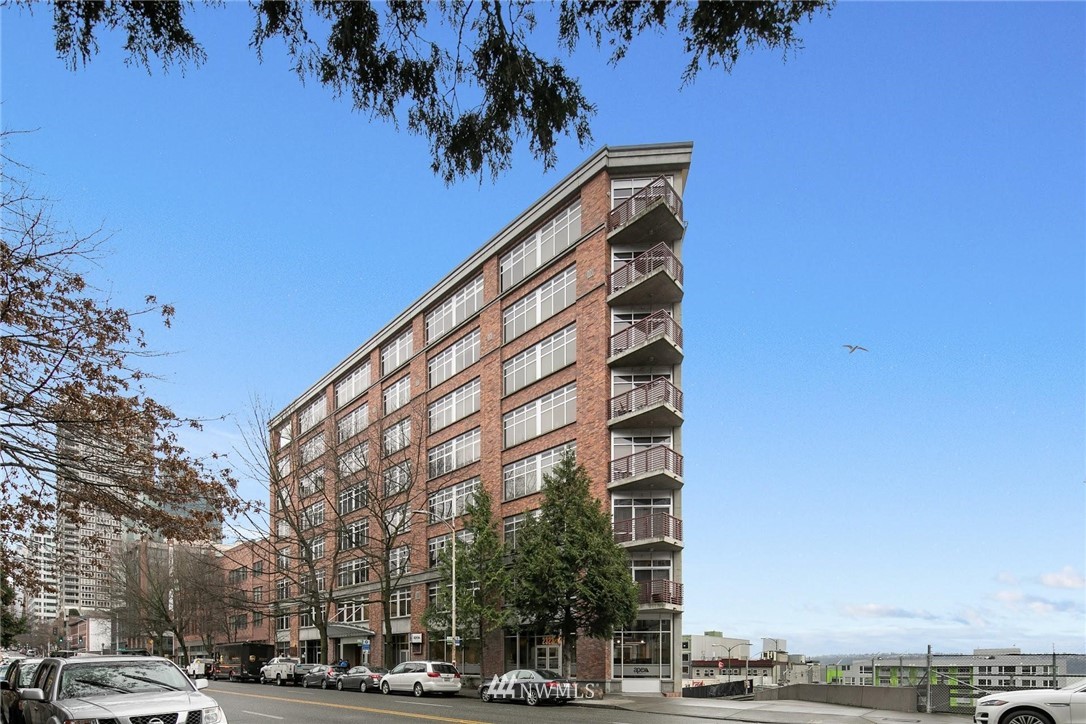 2319 1st Avenue, Unit 203 Seattle, WA 98121 - Photo 1 of 2 a view of a building with a tree