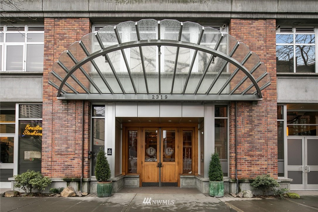 2319 1st Avenue, Unit 203 Seattle, WA 98121 - Photo 2 of 2 a front view of a building with entryway