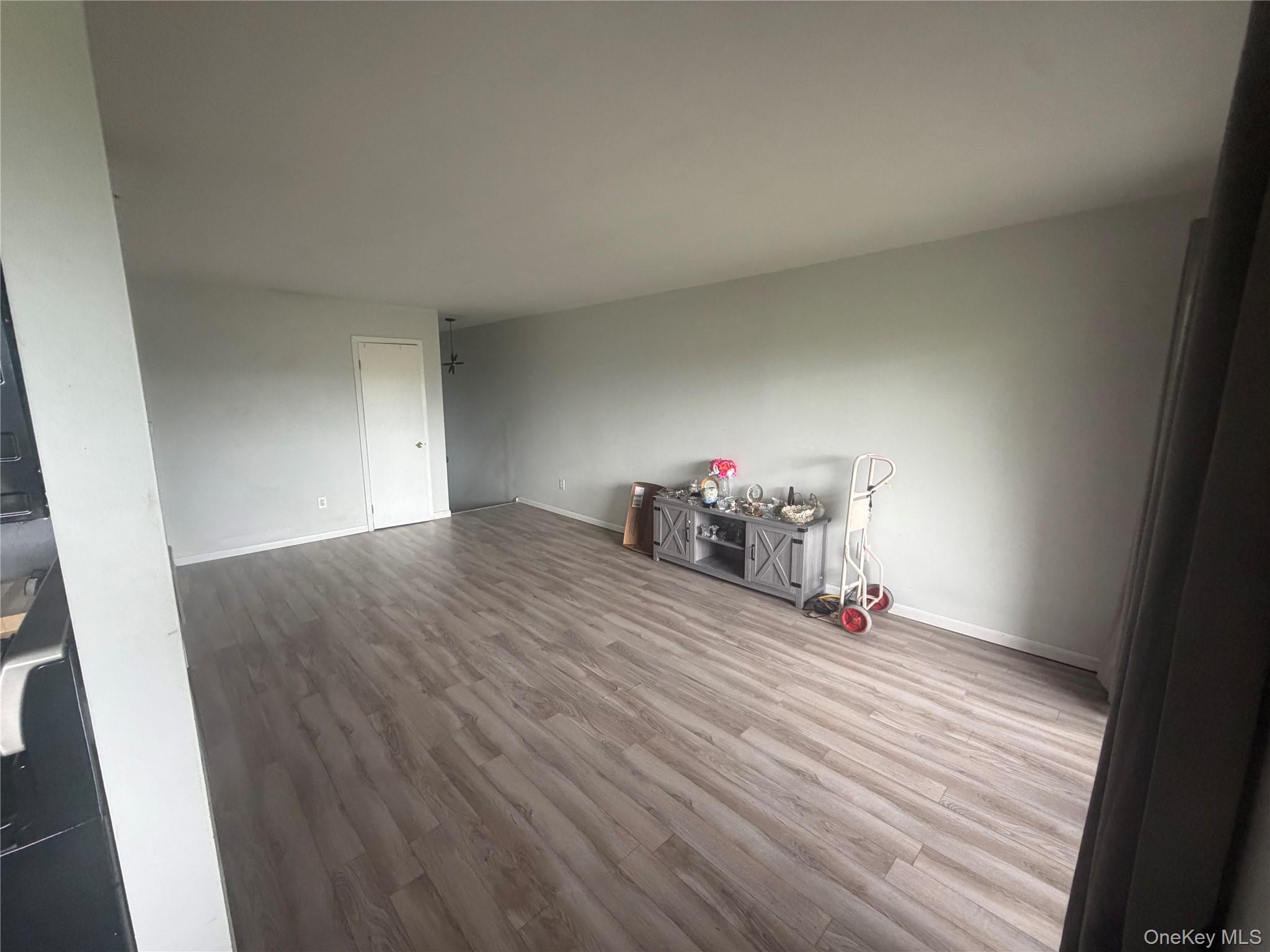 26 Cooper Road, Unit 312 Poughkeepsie, NY 12603 - Photo 3 of 13 a view of a room with wooden floor and equipment