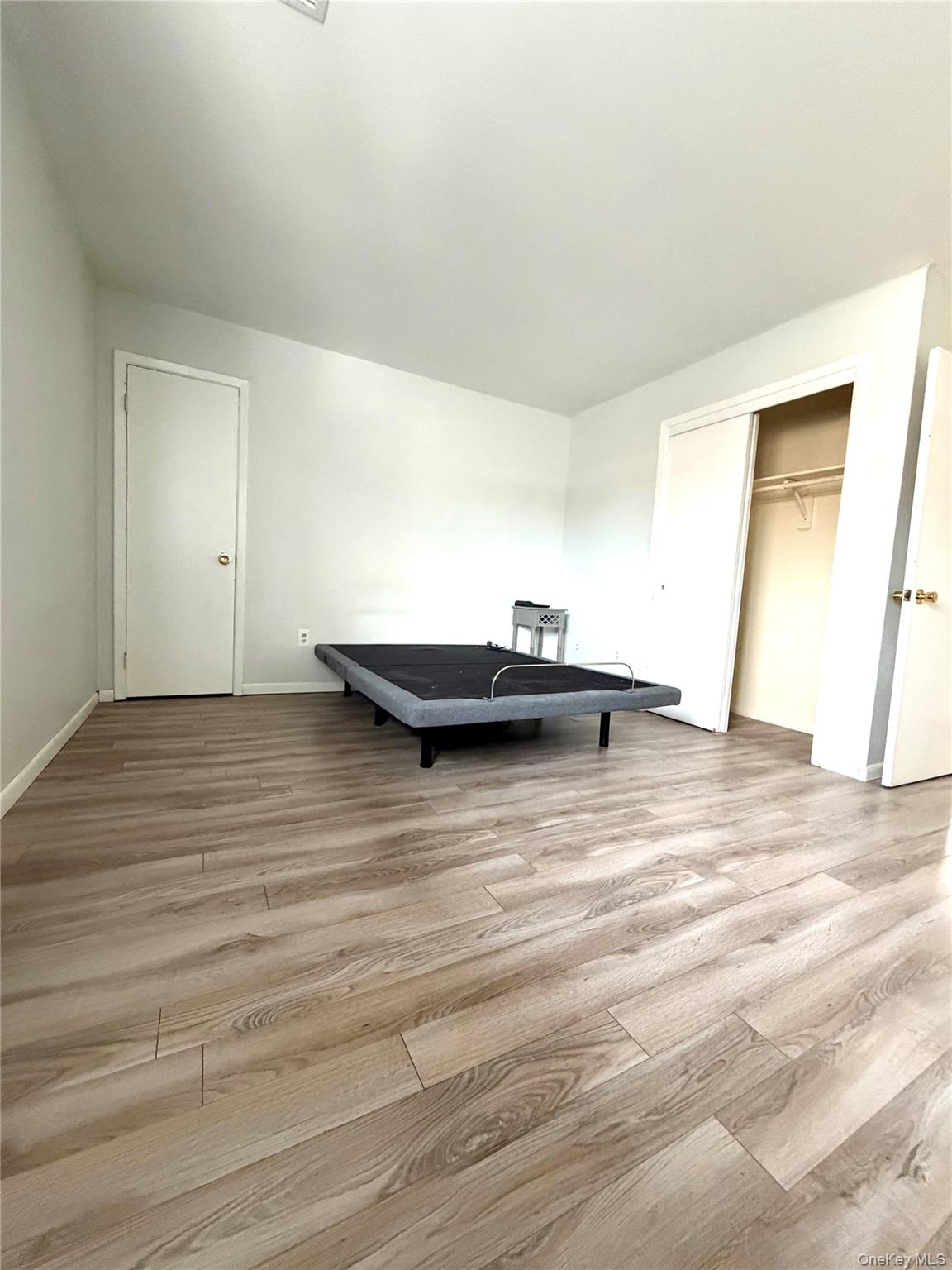 26 Cooper Road, Unit 312 Poughkeepsie, NY 12603 - Photo 8 of 13 a view of a room with wooden floor