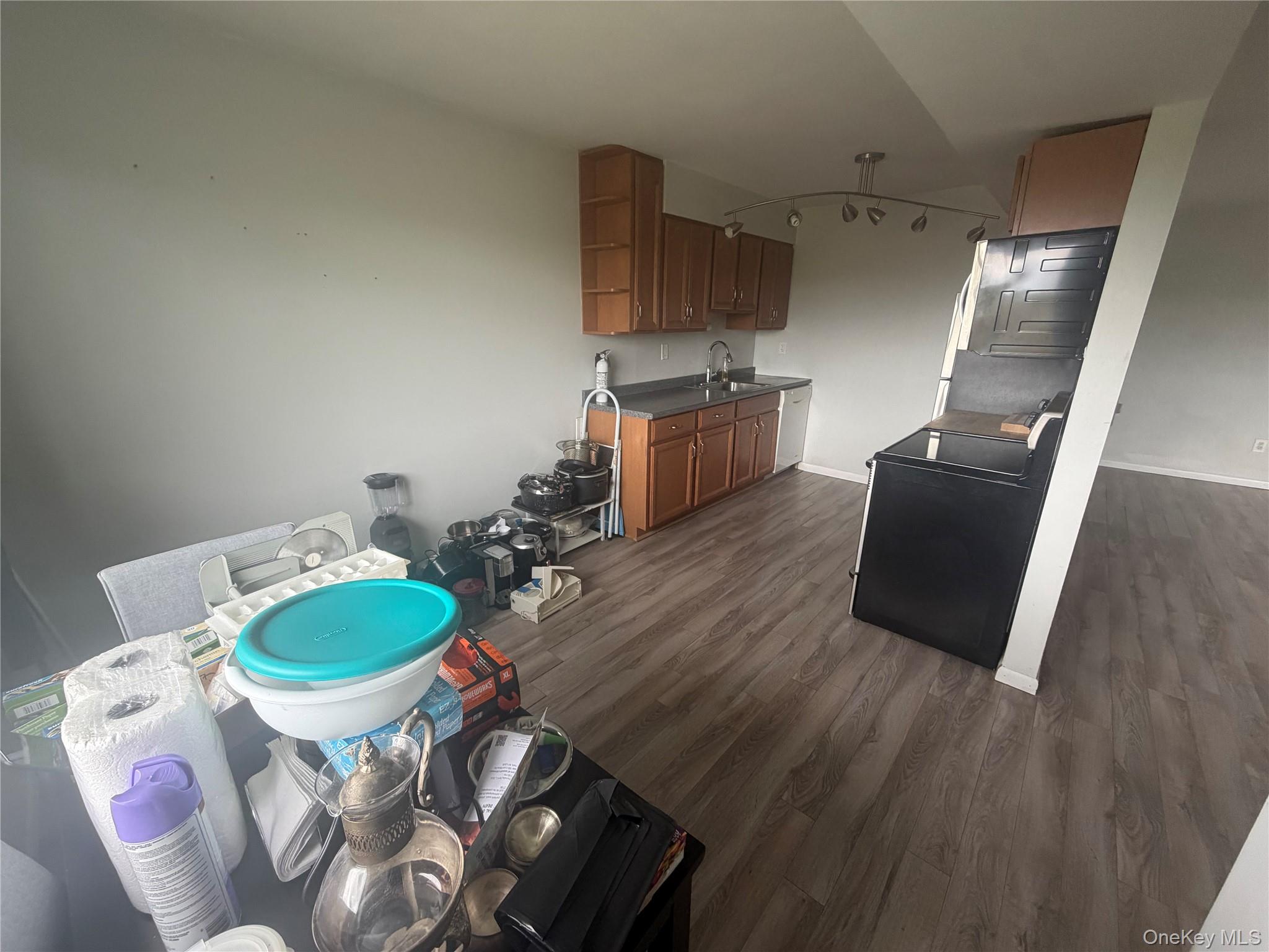 26 Cooper Road, Unit 312 Poughkeepsie, NY 12603 - Photo 10 of 13 a living room with furniture and a wooden floor