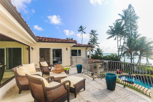 a view of a patio with couches and chairs