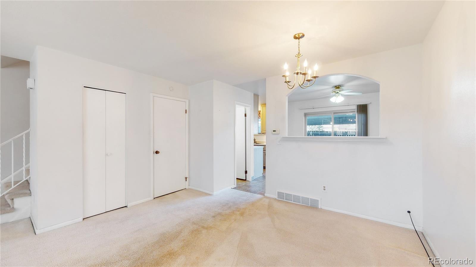 223 Holman Way Golden, CO 80401 - Photo 4 of 29 a view of a room with wooden floor and windows