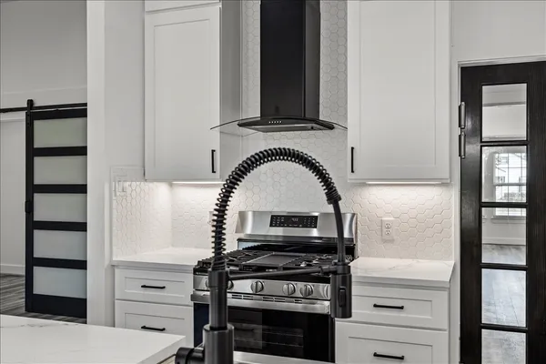 a view of an empty room and wooden floor