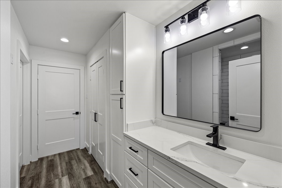 14103 3rd Street Santa Fe, TX 77517 - Photo 23 of 46 a bathroom with a sink and a mirror