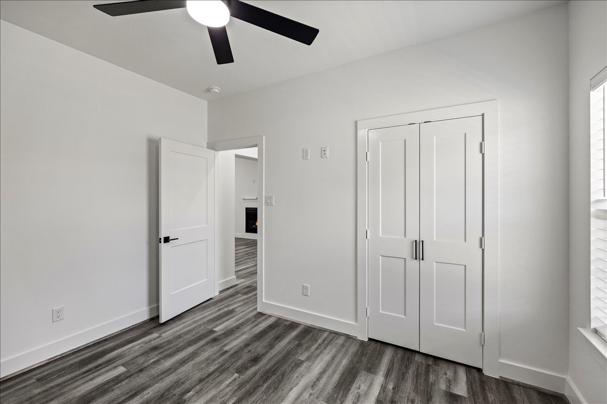 14103 3rd Street Santa Fe, TX 77517 - Photo 28 of 46 a view of empty room with wooden floor