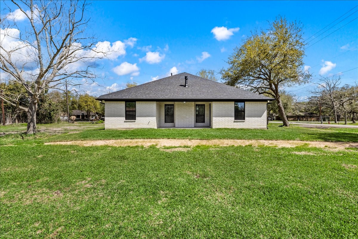 14103 3rd Street Santa Fe, TX 77517 - Photo 35 of 46 a front view of a house with a yard