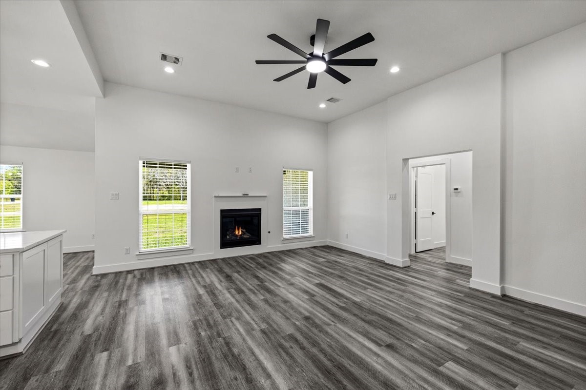 14103 3rd Street Santa Fe, TX 77517 - Photo 5 of 46 an empty room with windows and a fireplace