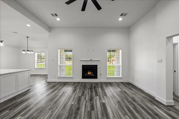 a kitchen with stainless steel appliances granite countertop a stove and a refrigerator