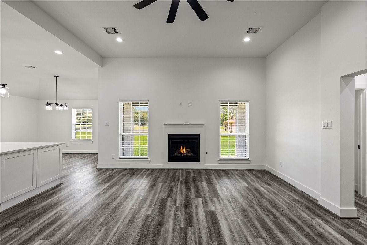 14103 3rd Street Santa Fe, TX 77517 - Photo 8 of 46 a view of an empty room with window and wooden floor