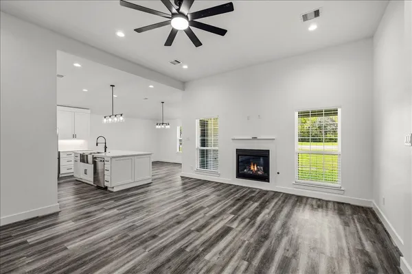 a kitchen with a stove a refrigerator and a sink