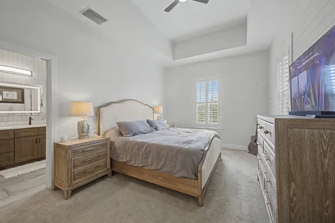 a bedroom with a bed and dresser