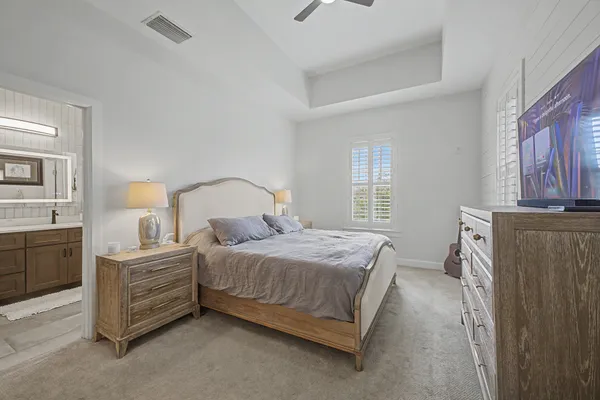 a bedroom with a bed and dresser