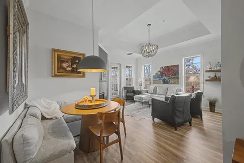 a dining room with furniture and window