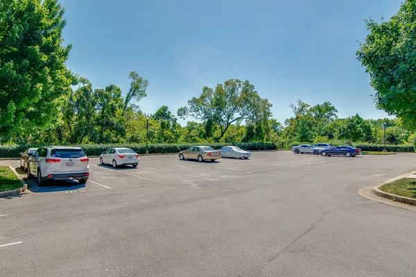 a front view of a residential apartment building with a street