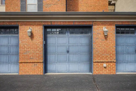 a front view of a residential apartment building with a yard