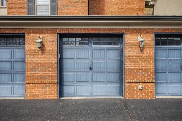 a front view of a residential apartment building with a yard