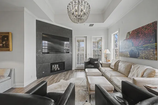 a living room with furniture and a fireplace