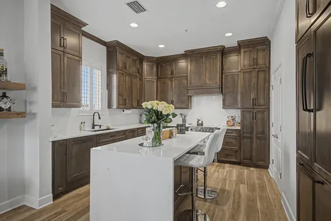 a kitchen with refrigerator and sink