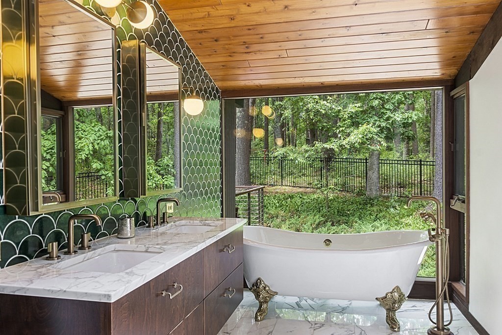 127 Commerford Road Concord, MA 01742 - Photo 16 of 33 a view of a bathroom with a tub and sink