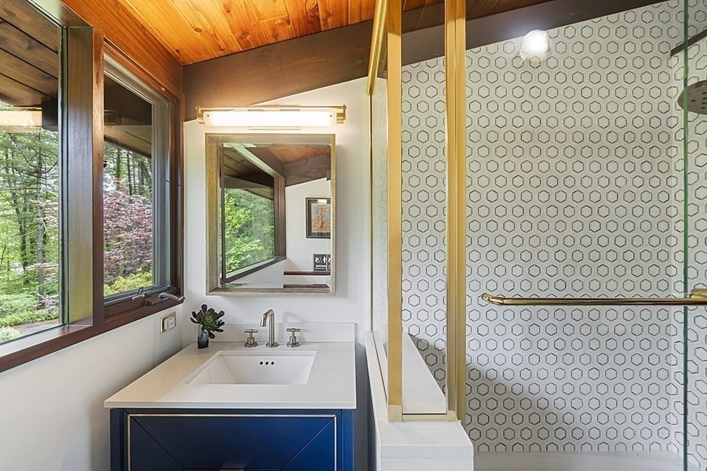 127 Commerford Road Concord, MA 01742 - Photo 17 of 33 a bathroom with a sink and a mirror