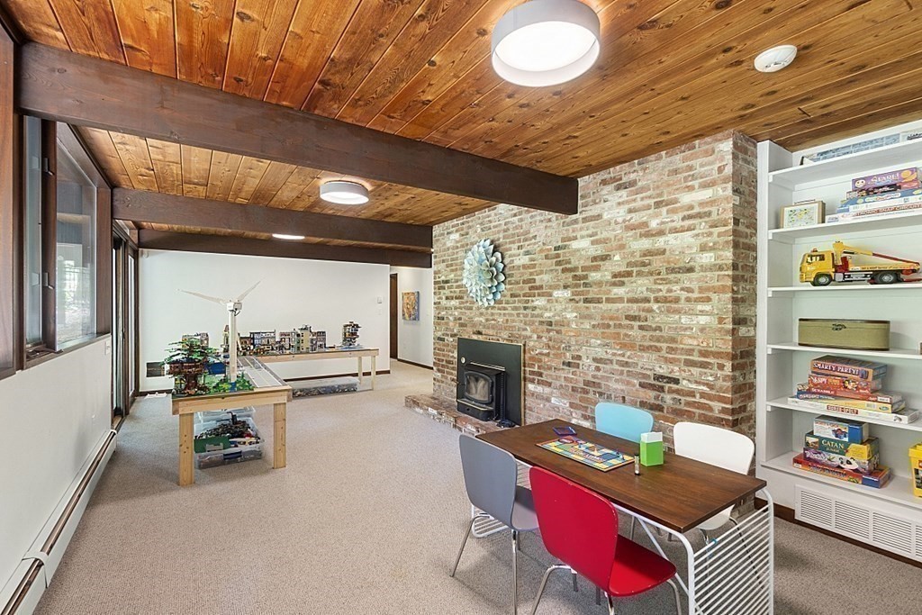 127 Commerford Road Concord, MA 01742 - Photo 18 of 33 a room with furniture and a fireplace