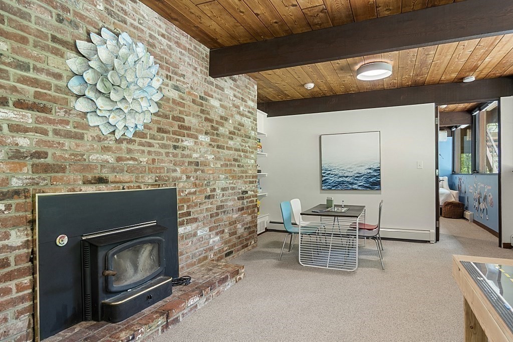 127 Commerford Road Concord, MA 01742 - Photo 19 of 33 a living room with furniture and a fireplace