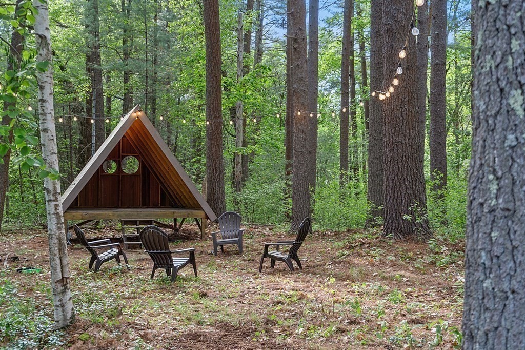 127 Commerford Road Concord, MA 01742 - Photo 32 of 33 a backyard of a house with table and chairs