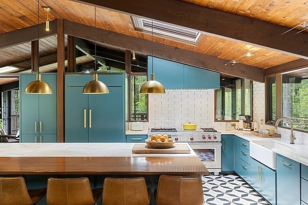 127 Commerford Road Concord, MA 01742 - Photo 8 of 33 a kitchen with a sink a stove and cabinets