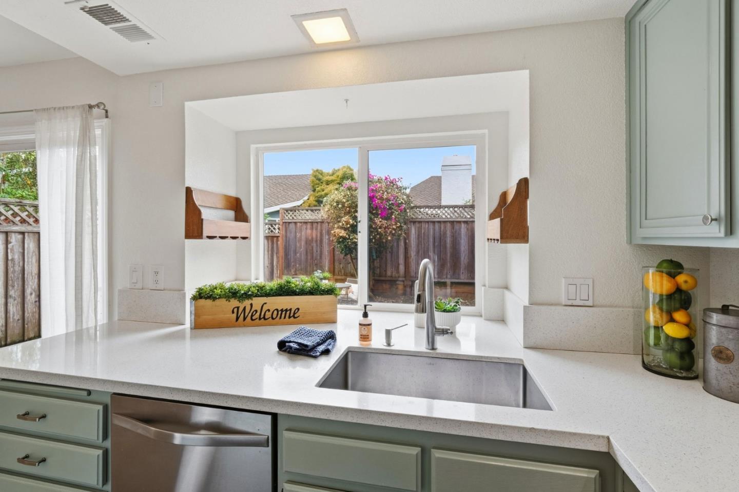 283 Perch Way Aptos, CA 95003 - Photo 11 of 37 a kitchen with a sink and a potted plant
