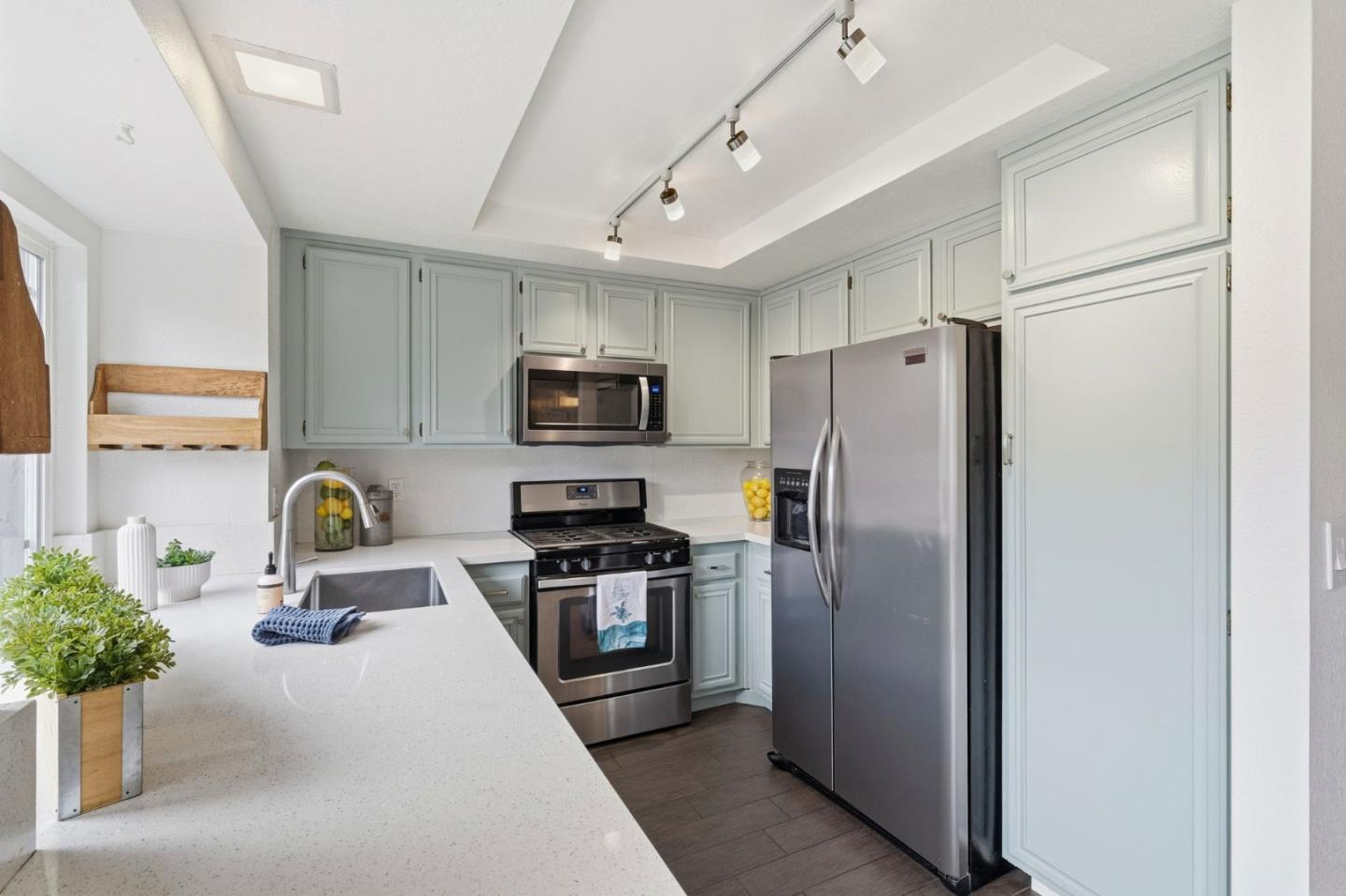 283 Perch Way Aptos, CA 95003 - Photo 12 of 37 a kitchen with stainless steel appliances granite countertop a refrigerator a stove a sink a counter space and wooden floor