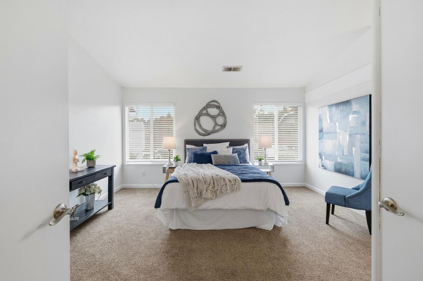 283 Perch Way Aptos, CA 95003 - Photo 20 of 37 a bed room with furniture and a chandelier