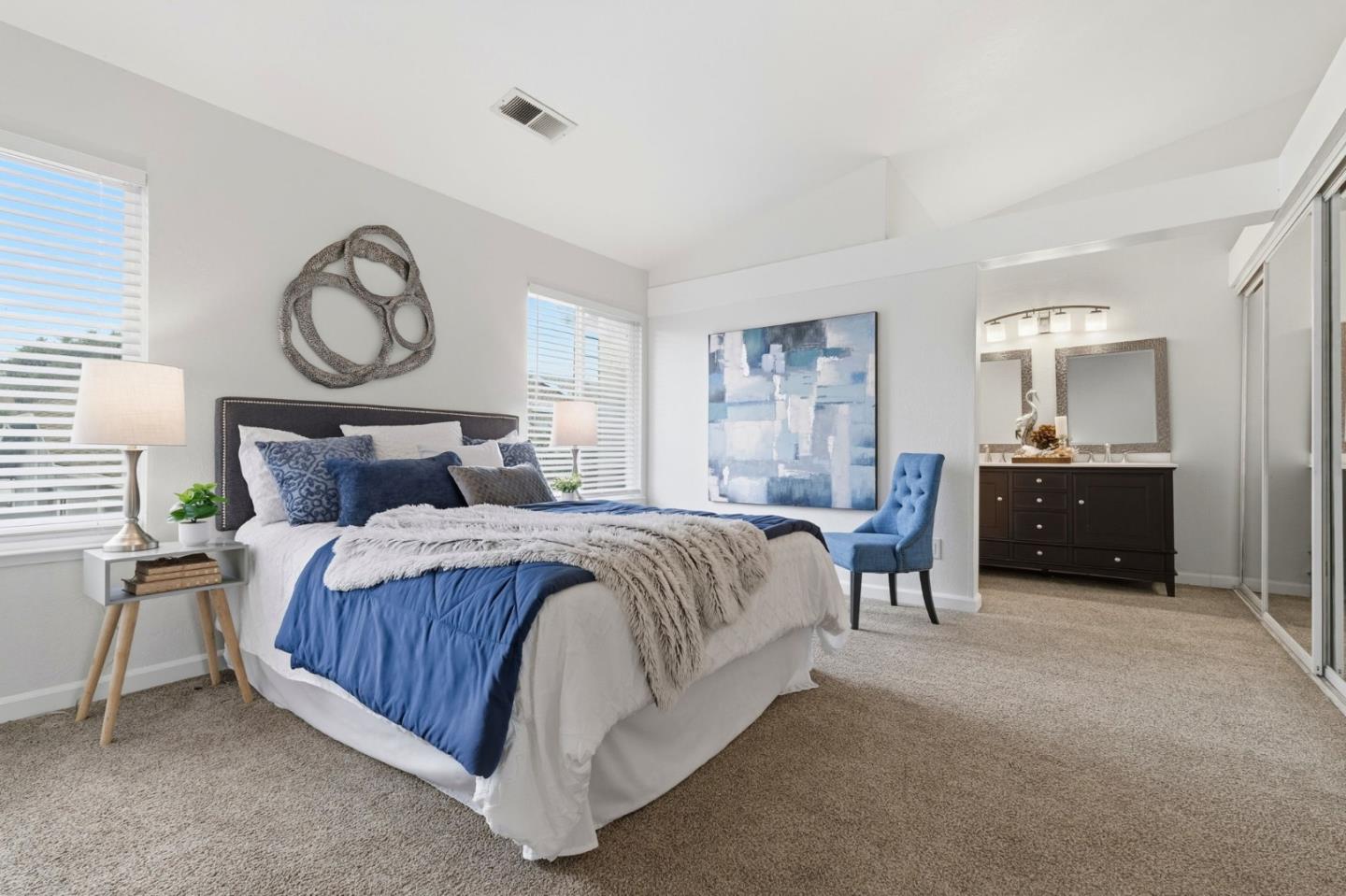 283 Perch Way Aptos, CA 95003 - Photo 21 of 37 a bedroom with a bed and a chandelier