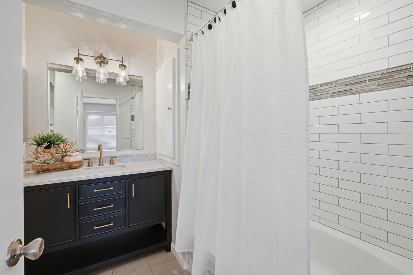 283 Perch Way Aptos, CA 95003 - Photo 31 of 37 a bathroom with a double vanity sink and a mirror