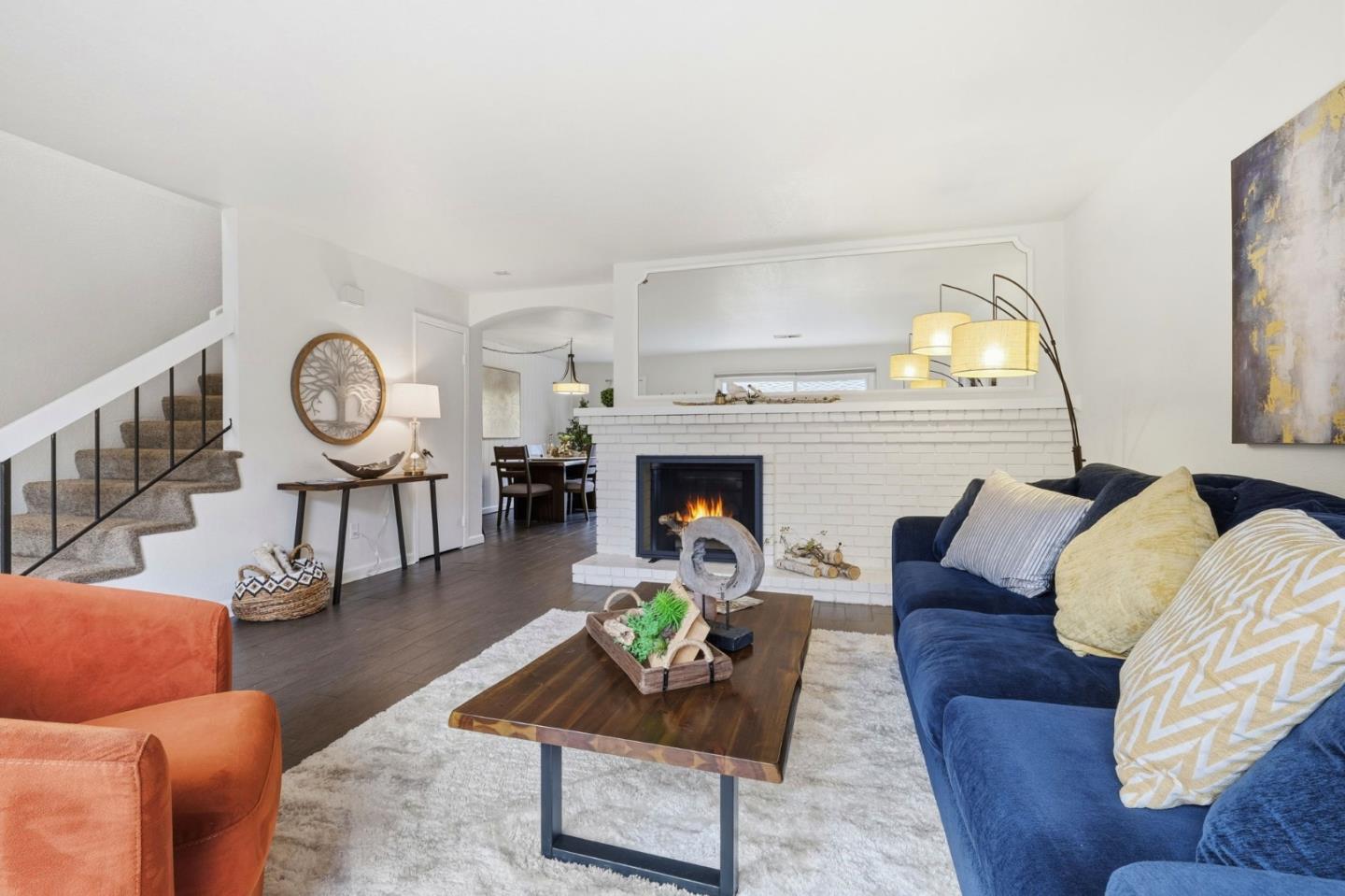 283 Perch Way Aptos, CA 95003 - Photo 6 of 37 a living room with furniture a fireplace and a large window