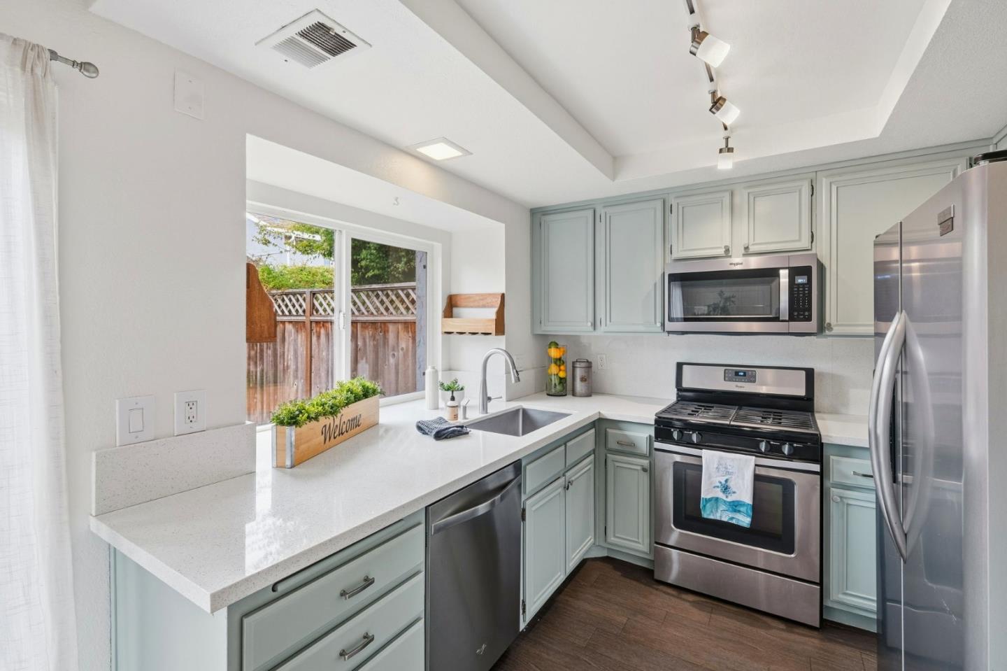 283 Perch Way Aptos, CA 95003 - Photo 9 of 37 a kitchen that has a sink and a stove