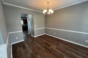 4557 Ivy Patch Drive Fortson, GA 31808 - Photo 14 of 27 a view of wooden floor and chandelier in a room