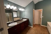4557 Ivy Patch Drive Fortson, GA 31808 - Photo 15 of 27 a bathroom with a granite countertop sink and a mirror