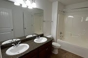 4557 Ivy Patch Drive Fortson, GA 31808 - Photo 21 of 27 a bathroom with a sink and a mirror