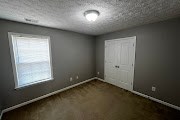 4557 Ivy Patch Drive Fortson, GA 31808 - Photo 24 of 27 an empty room with a window