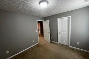 4557 Ivy Patch Drive Fortson, GA 31808 - Photo 25 of 27 an empty room with closet area