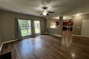 4557 Ivy Patch Drive Fortson, GA 31808 - Photo 3 of 27 wooden floor in an empty room with a window