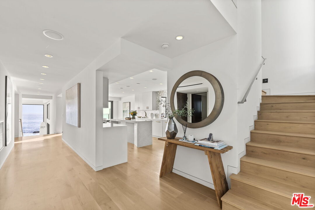 24146 Malibu Road Malibu, CA 90265 - Photo 6 of 26 a view of a livingroom with furniture and staircase