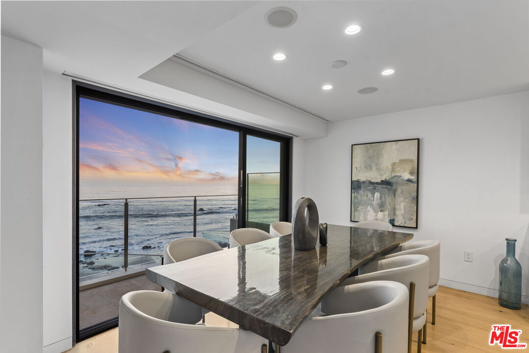 24146 Malibu Road Malibu, CA 90265 - Photo 9 of 26 a kitchen with a table and chairs