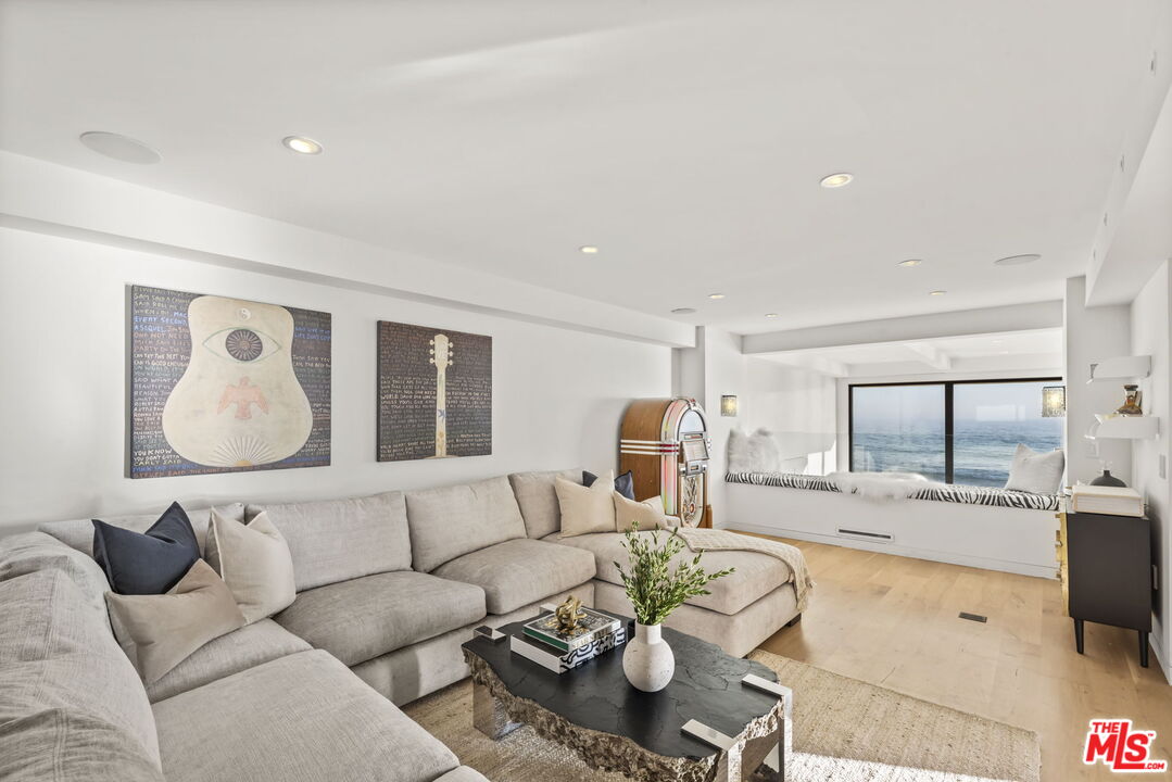 24146 Malibu Road Malibu, CA 90265 - Photo 10 of 26 a living room with furniture and a large window
