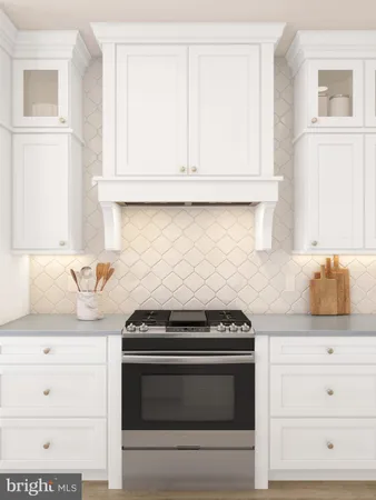 a kitchen with granite countertop white cabinets and appliances