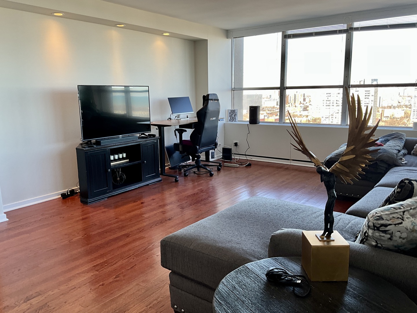 655 West Irving Park Road, Unit 2110 Chicago, IL 60613 - Photo 11 of 38 a living room with furniture window and a flat screen tv