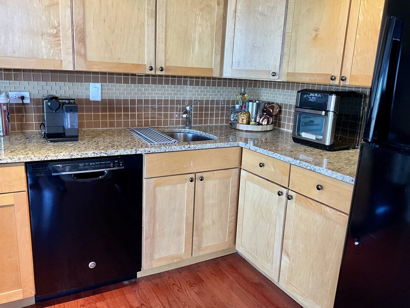 655 West Irving Park Road, Unit 2110 Chicago, IL 60613 - Photo 14 of 38 a kitchen with stainless steel appliances granite countertop a sink stove and cabinets