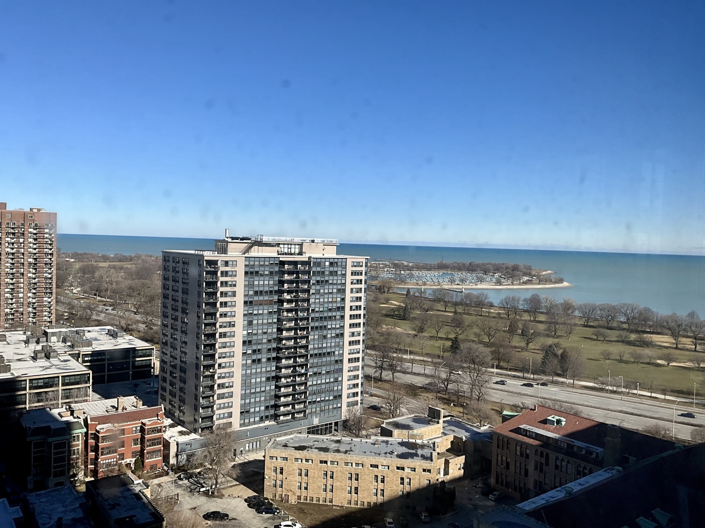 655 West Irving Park Road, Unit 2110 Chicago, IL 60613 - Photo 17 of 38 a view of a balcony with two chairs and a table